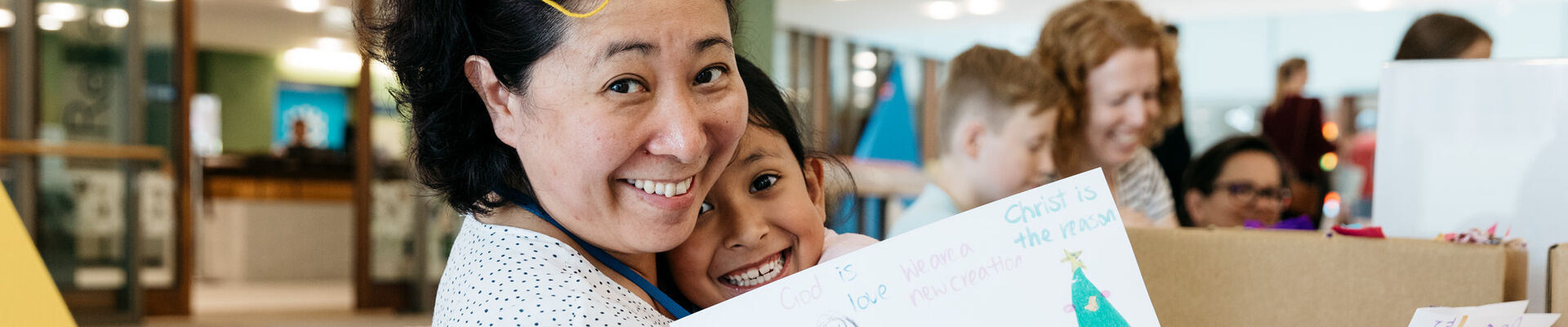 Mother and daughter sharing their completed book making activity