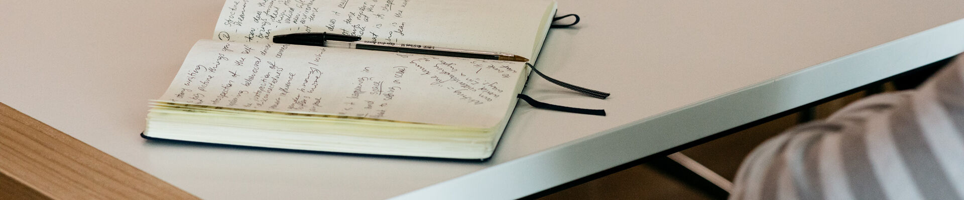 Notebook with notes on table