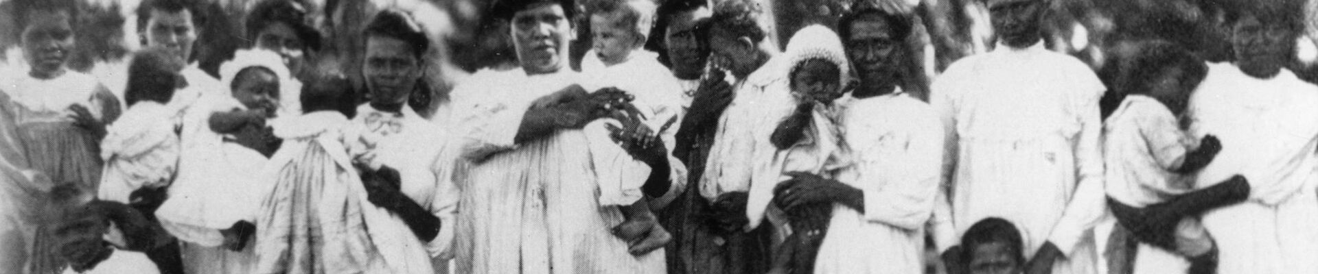 Young Aboriginal women with their babies and small children Mapoon
