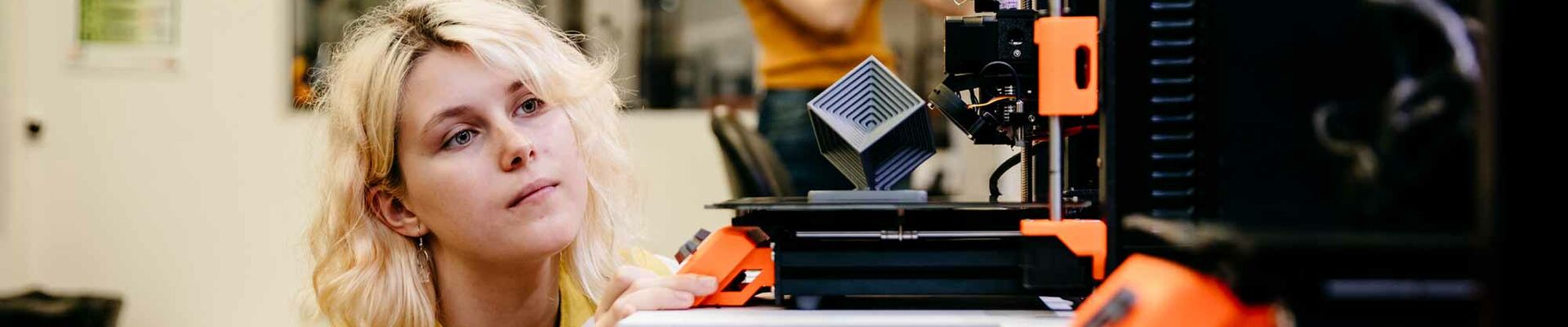 3D printer Woman using a 3D printer at The Edge