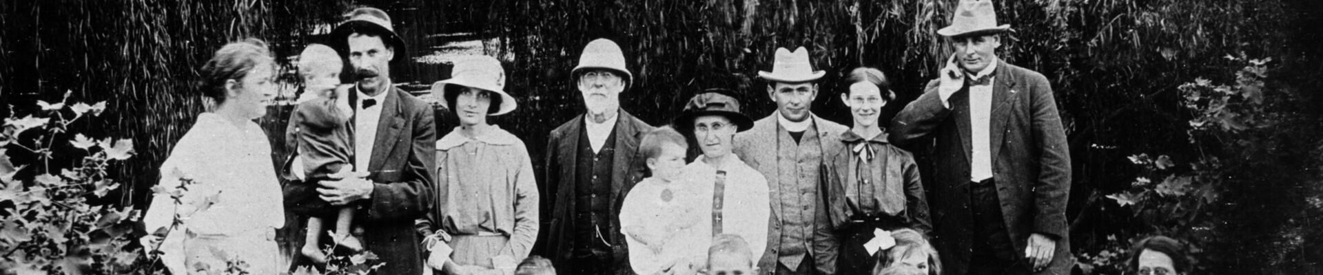 Portrait of the Morrow family taken outdoors in a rainforest setting at Gatton
