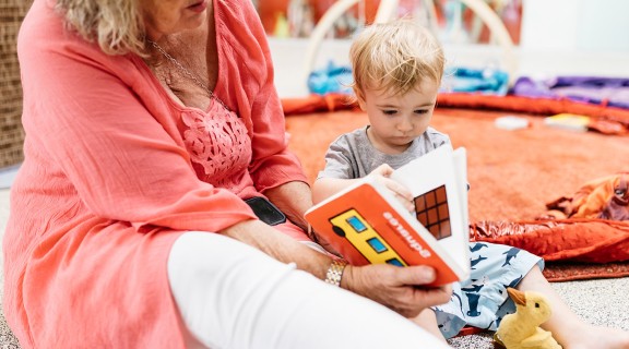 Grandma reading to grandson