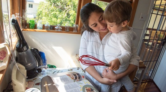 Woman and son reading a recipe together