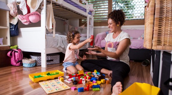 Mother and daughter playing with Lego