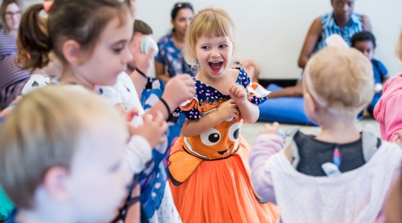Preschoolers singing and dancing at a First 5 Forever session