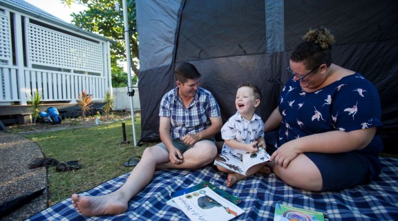 Family enjoying outdoor picnic in backyard