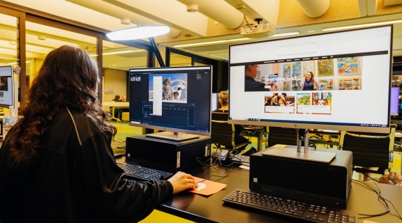 Photo of a woman looking at a screen