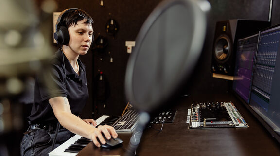 Person using the SLQ Recording Studio