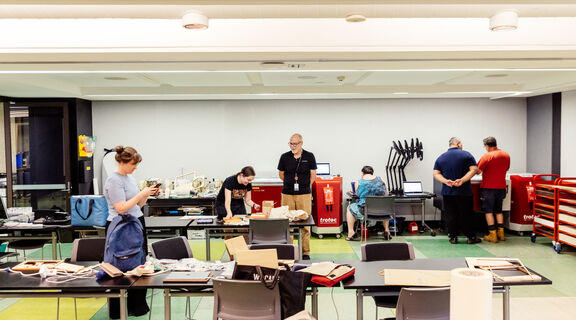 A photo of people working in the State Library makerspace