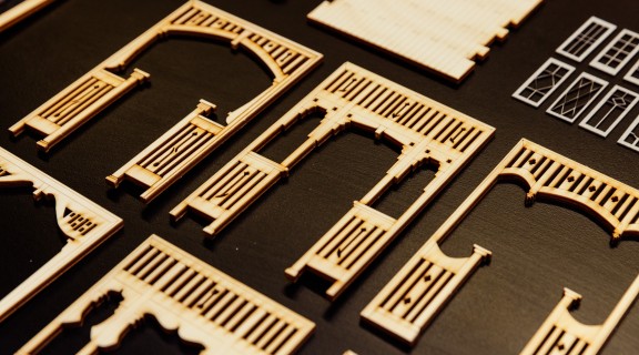 A photo of a row of laser cut miniature archways