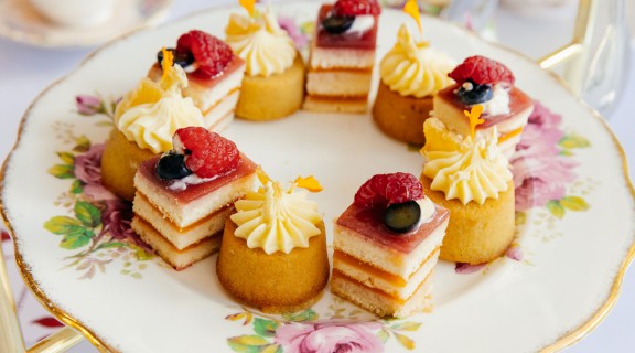 Small cakes on an ornate plate.