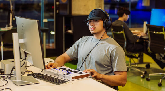 A photo of a person using a midi keyboard
