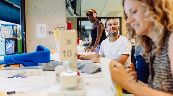 A photo of people sewing at The Edge