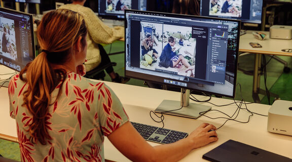 Edge user using photoshop to retouch a photograph