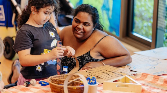 Child and adult doing craft