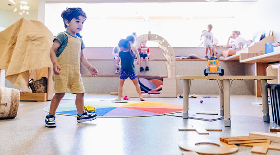 Child plays in The Corner