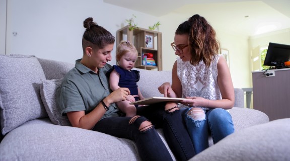 Two parents with their baby