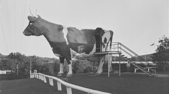 Large statue of a cow with horns.