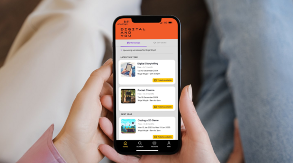 Hands holding a smartphone with the Digital and You app
