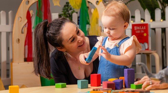 Baby playing with parent