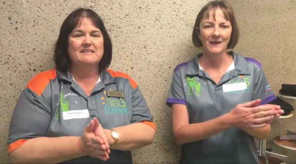 Two library staff singing Barramundi song