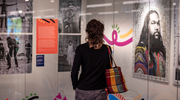 Visitor looking at Deaf in dance showcase in kuril dhagun