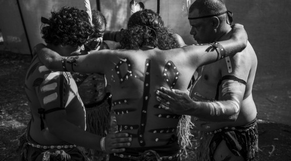 Deaf Indigenous Dance Group dancers huddle at the Laura Quinkan Dance Festival, July 2021.