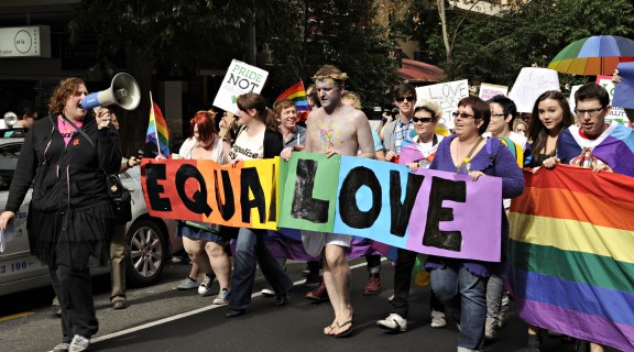Woman with megaphone during march at Marriage Equality Rally in Brisbane, 2011