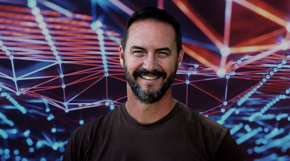 Image of Dr Peter Ellerton on digital image background