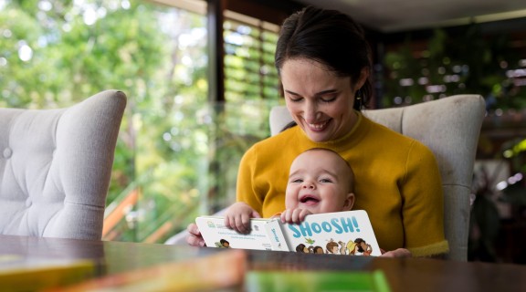 Mother and daughter reading Shoosh! board book