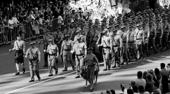8th/9th Battalion, Royal Australian regiment, marching with their mascot, a Merino ram called John MacArthur, in front of crowds in the Brisbane Anzac Day Parade, 25 April 2015