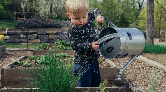 Child with watering can