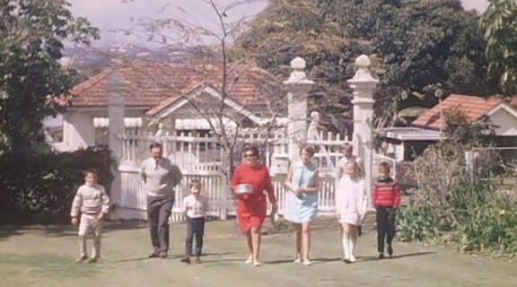 Family arriving for a backyard picnic