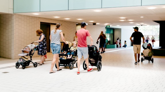 Visitors pushing prams through the Knowledge Walk at State Library.