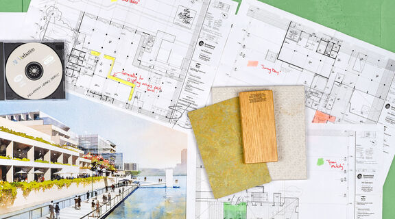 Flat lay of architectural plans, drawings and items from the Millennium Library Project