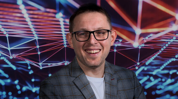 Image of Professor Marek Kowalkiewicz on digital image background