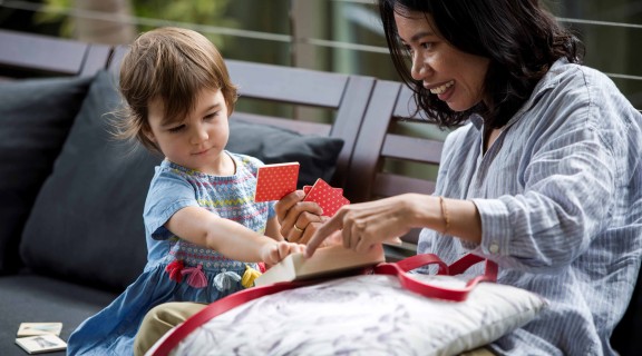Woman and child with cards