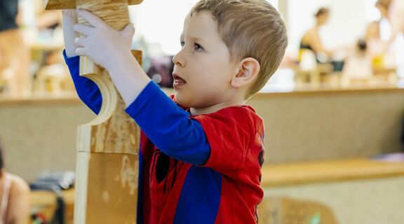 Boy stacking blocks