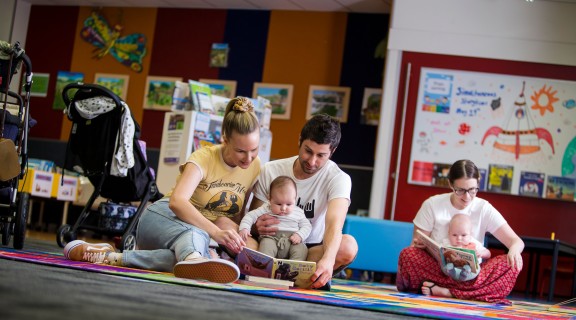 Parents and babies play and reading session at Logan Library