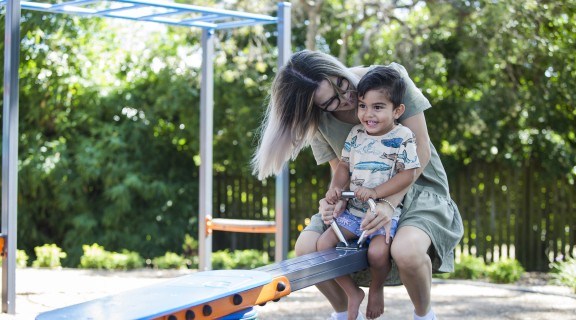 Mother and child playing at the park