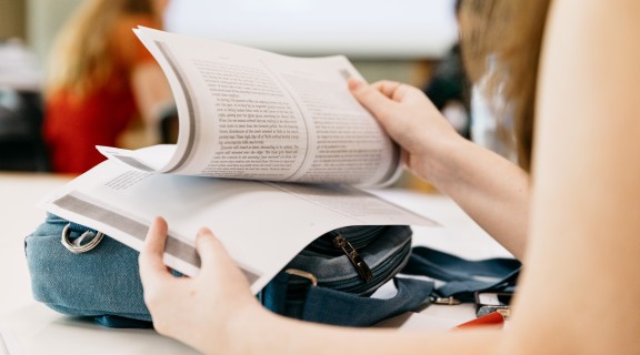 Young writer reading a short story 