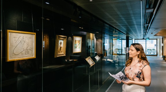 Visitor viewing the Talbot Family Treasures Wall