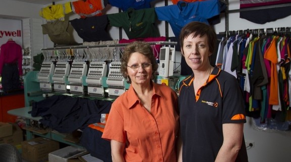 A store and the shopkeeping staff photographed in the town of Dalby for the Queensland Small Towns project