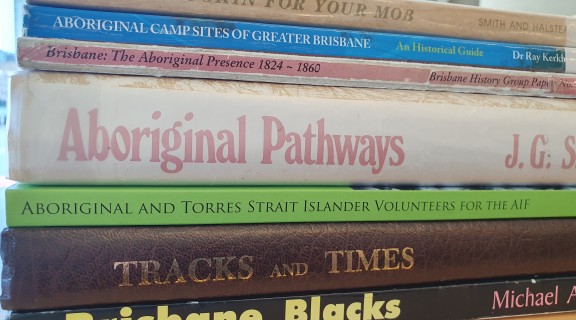 Stack of books relating to First Nations peoples