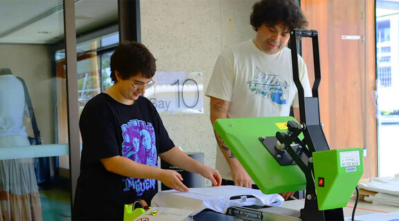 2 people enjoying a digital fabric printing workshop