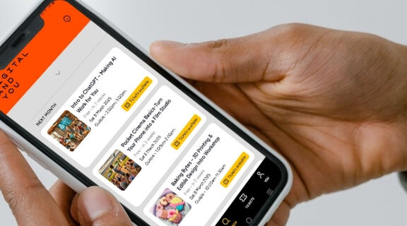 A person using the Digital and You app to view a list of free digital workshops taking place in their selected location