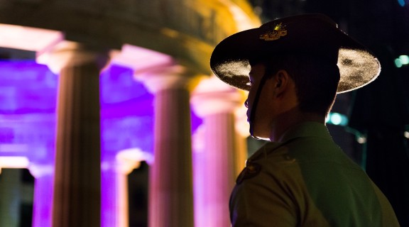 Young soldier standing at attention during the Anzac Day dawn service in Brisbane, 2014