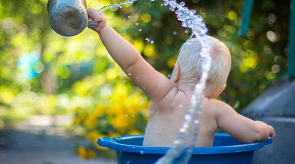 Baby playing in the bath