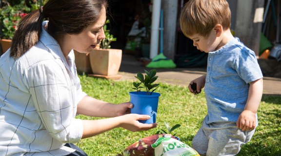 Mother and boy gardening