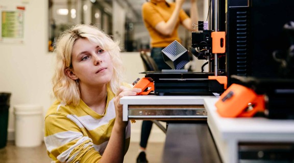 Woman using a 3D printer at The Edge.